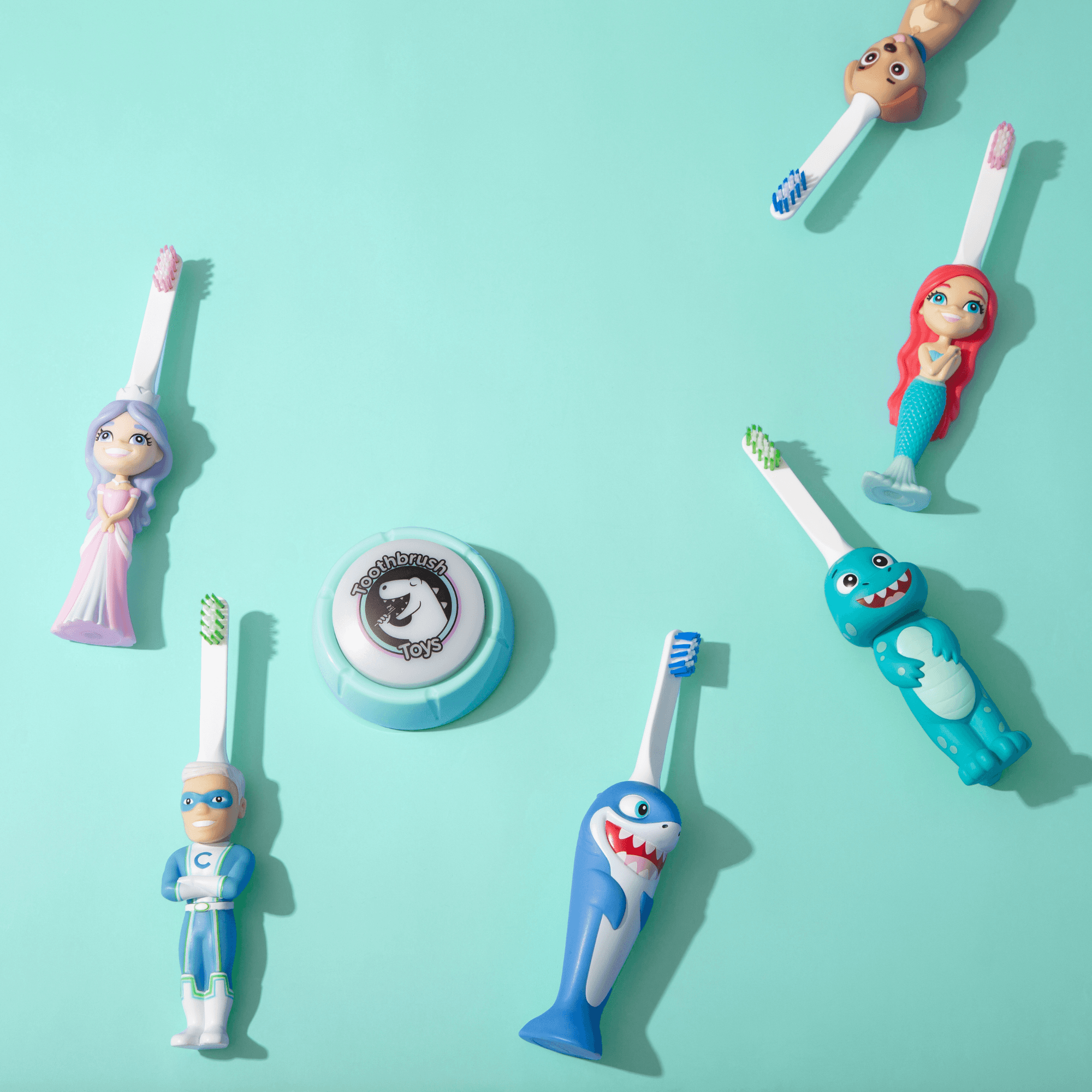 Assorted character toothbrush designs including Brushy on a turquoise background